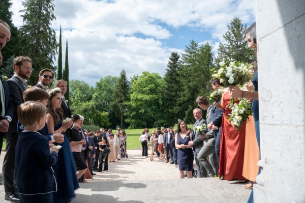 Guests await the bride and groom exterior church setting